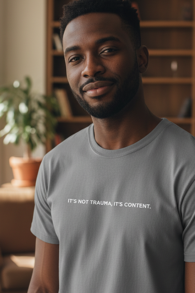 African American man wearing IT'S NOT TRAUMA IT'S CONTENT shirt