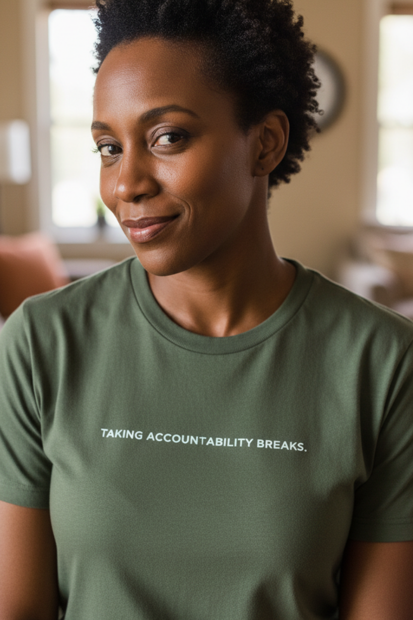 African American woman wearing TAKING ACCOUNTABILITY BREAKS shirt