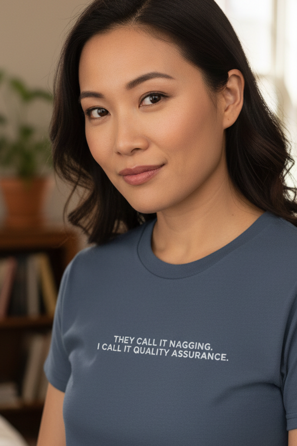 Asian woman wearing THEY CALL IT NAGGING I CALL IT QUALITY ASSURANCE shirt