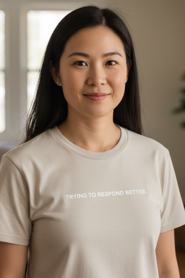 Asian woman wearing TRYING TO RESPOND BETTER shirt
