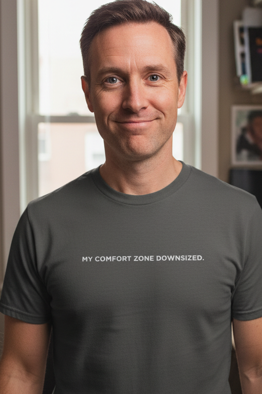 Caucasian man wearing MY COMFORT ZONE DOWNSIZED shirt
