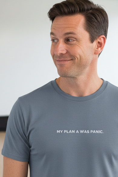 Caucasian man wearing MY PLAN A WAS PANIC shirt