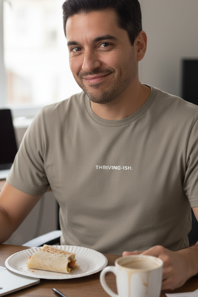Hispanic man wearing THRIVING-ISH shirt