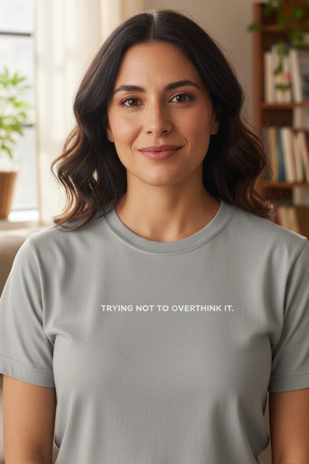 Middle Eastern woman wearing TRYING NOT TO OVERTHINK IT shirt